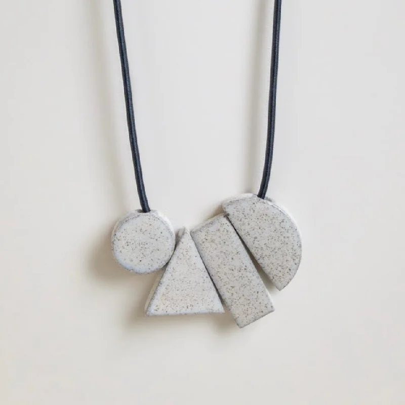 Geo tangram gloss speckle necklace by Janneke